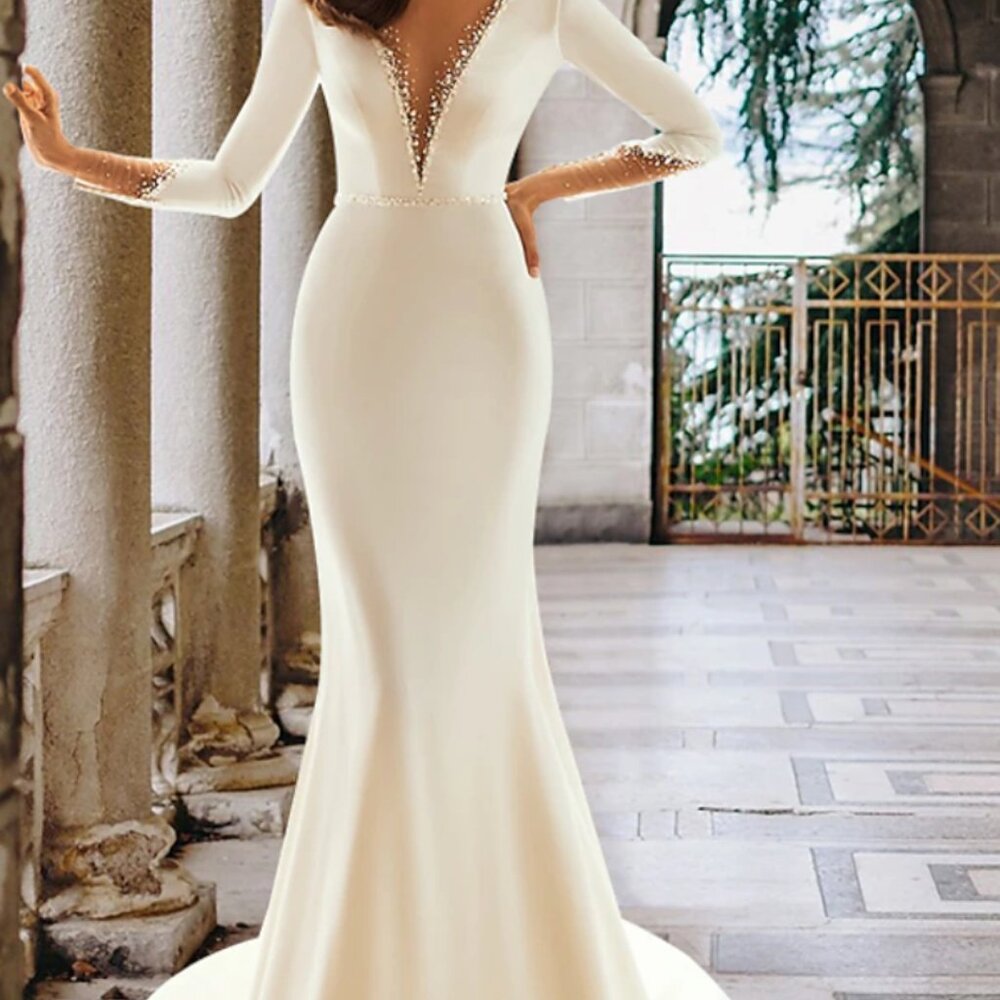 Elegant Ivory Long Sleeve Wedding Dress with Beaded Plunge V-Neck